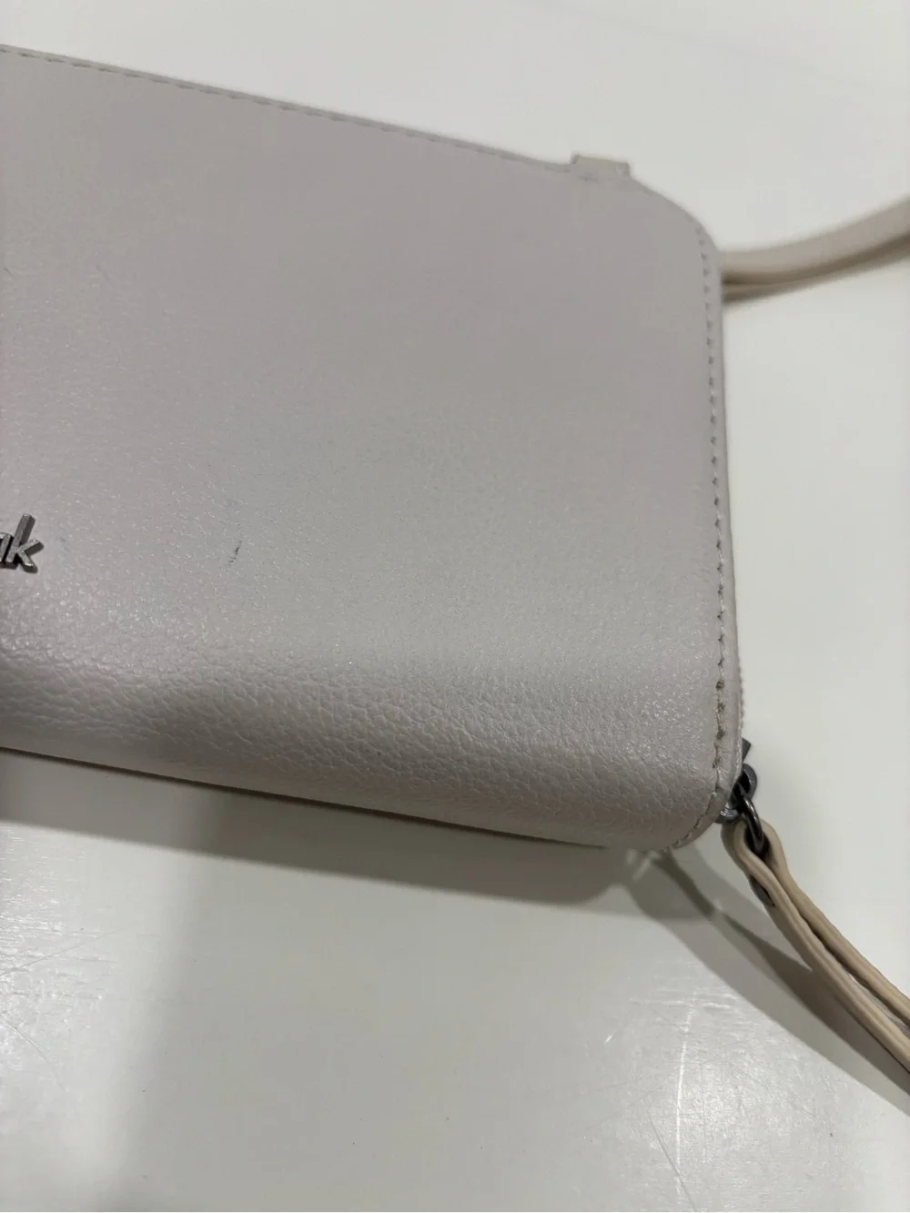 The Sak Light Cream Wristlet Clutch